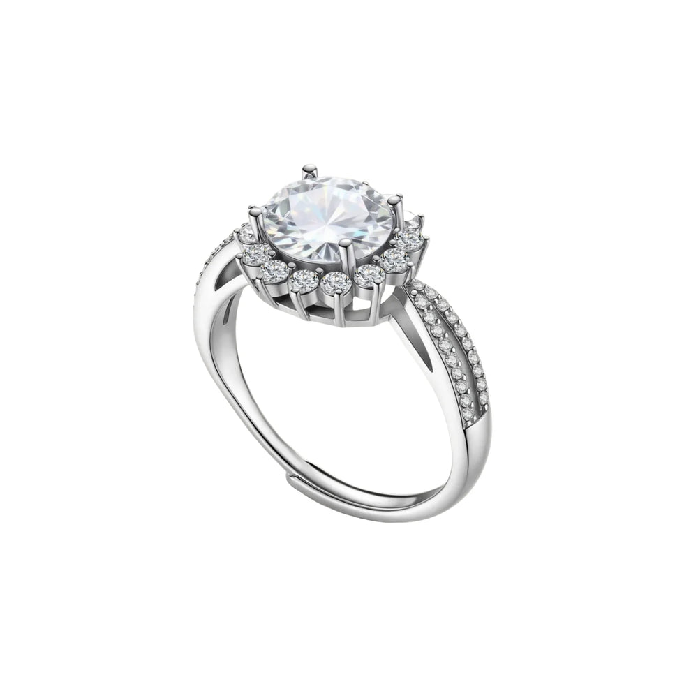 Close-up of sterling silver halo ring with brilliant round moissanite center stone surrounded by smaller accent stones