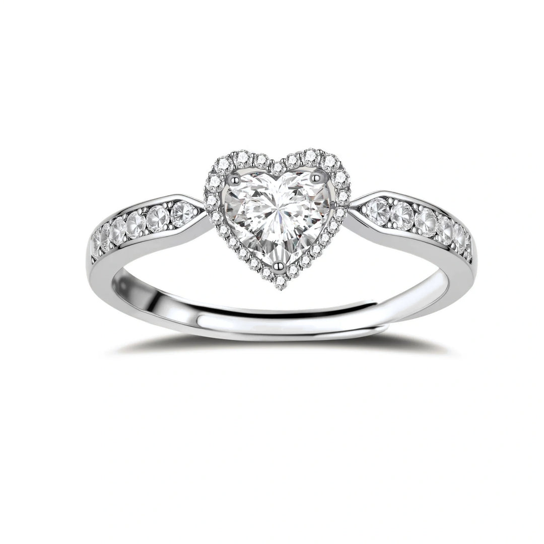 Complete jewelry set with heart-shaped sterling silver pieces featuring brilliant moissanite stones on white background.